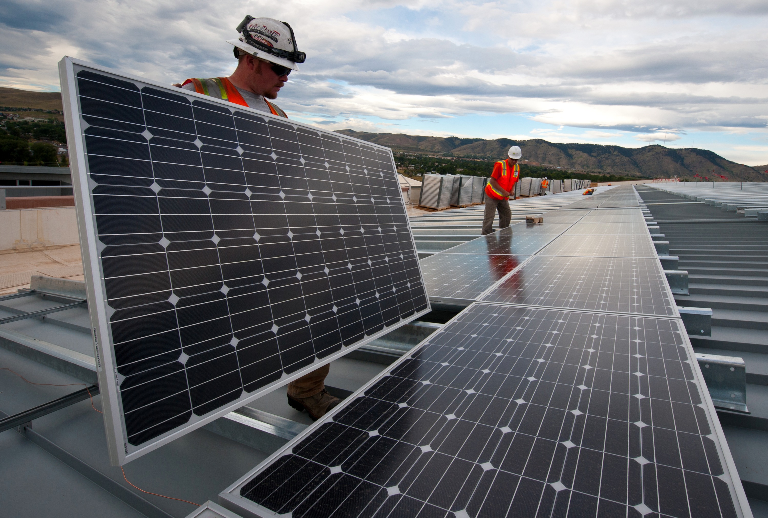 Solar engineer installing panels on a roof in Ireland